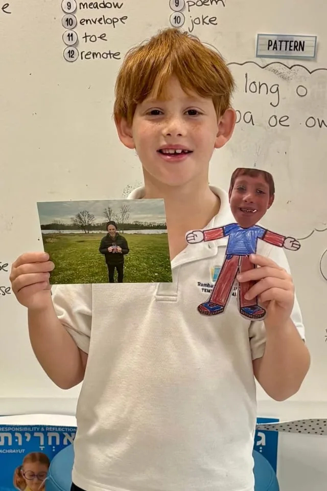 boy shows flat stanley