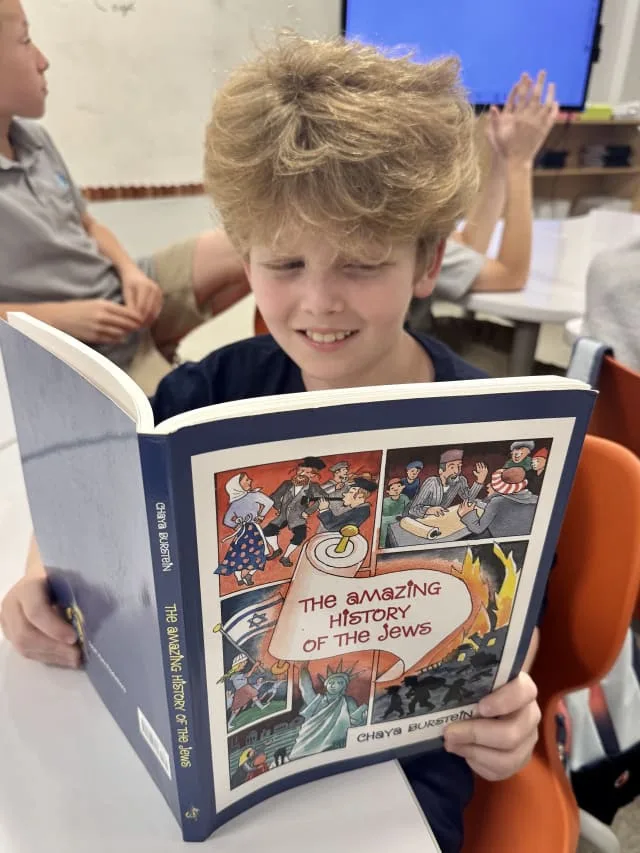 boy read The Amazing History of the Jews